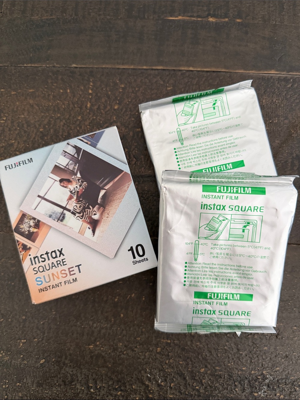 Instax film on wooden surface